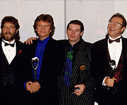 Doug Clifford, John Fogerty, Jeff Fogerty, son of Tom Fogerty, & Stuart Cook. Rock and Roll Hall of Fame, January 12, 1993, Century Plaza Hotel, Los Angeles, CA (Photo by Jeff Kravitz/FilmMagic, Inc).