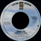New Kid In Town / Victim Of Love, Asylum USA E-45373, 7 Dec 1976, 7″45 RPM.