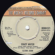 Crazy Water / Chameleon, The Rocket Record Company UK, ROKN 521, February 04, 1977, 7″45 RPM.