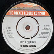 Song For Guy / Lovesick, The Rocket Record Company UK, XPRES 5, November 28, 1978, 7″45 RPM.