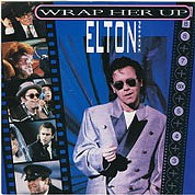 Wrap Her Up / Restless (Live), The Rocket Record Company UK, EJS 10, November, 1985, 7″45 RPM.