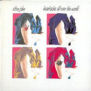 Heartache All Over The World / Highlander, The Rocket Record Company UK, EJS 12, September 1986, 7″45 RPM.