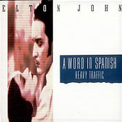 A Word In Spanish /Heavy Traffic, The Rocket Record Company UK, EJS 18, November, 1988, 7″45 RPM.