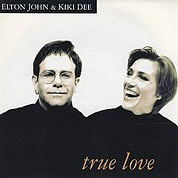 Elton John And Kiki Dee - True Love / The Show Must Go On (Live Version), The Rocket Record Company UK, EJS 32,  November, 1993 7″45 RPM.