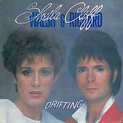 Sheila Walsh And Cliff Richard: Drifting / It's Lonely When The Lights Go On, DJM SHEIL 1, May 1983, 7″45 RPM.