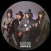 Myzsterious Mizster Jones / Mama Nature Is A Rockern, RCA PB 40027, Picture Disc 1May 1985, 7″45 RPM.