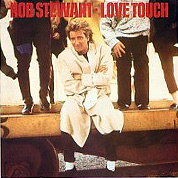 Love Touch / Heart Is On The Line, Warner Bros. W8668, May 1986, 7″45 RPM.