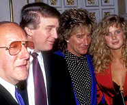 Donald Trump at a circa 1990 event with Clive Davis, Rod Stewart, and Rachel Hunter.